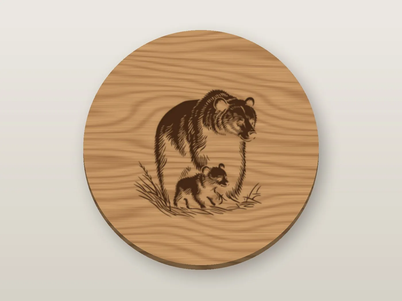 A round cherry wood coaster engraved with a mother bear and her cub